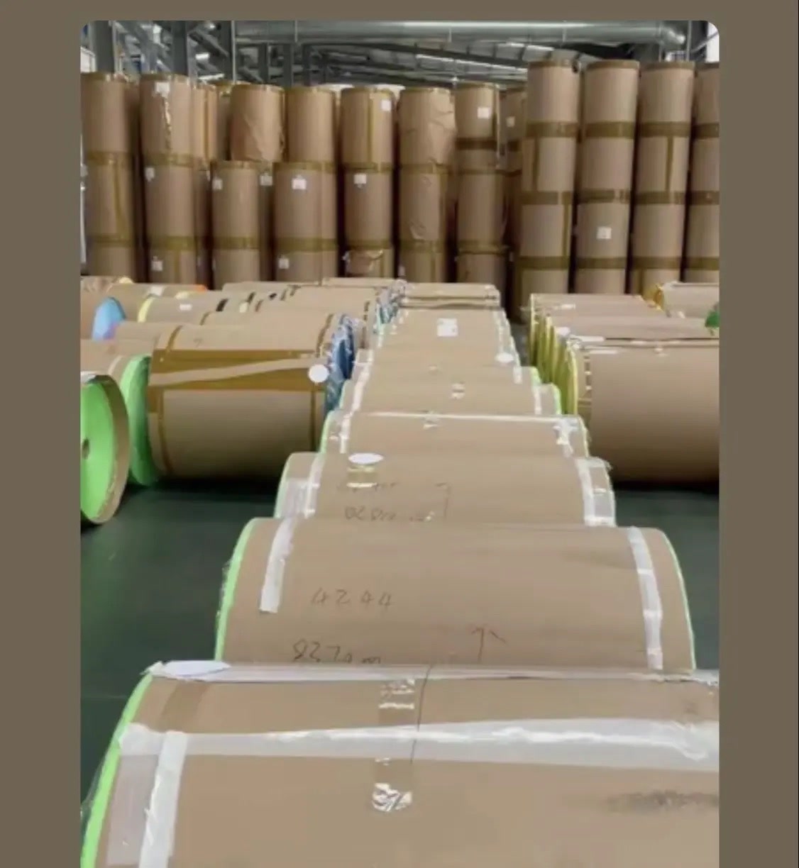 Packed masking tape master rolls in warehouse